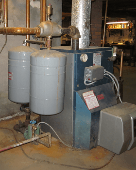 Image of hydronic heating system with a boiler operating on fossil fuel as the heat source. 