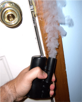 A person using a smoke canister.
